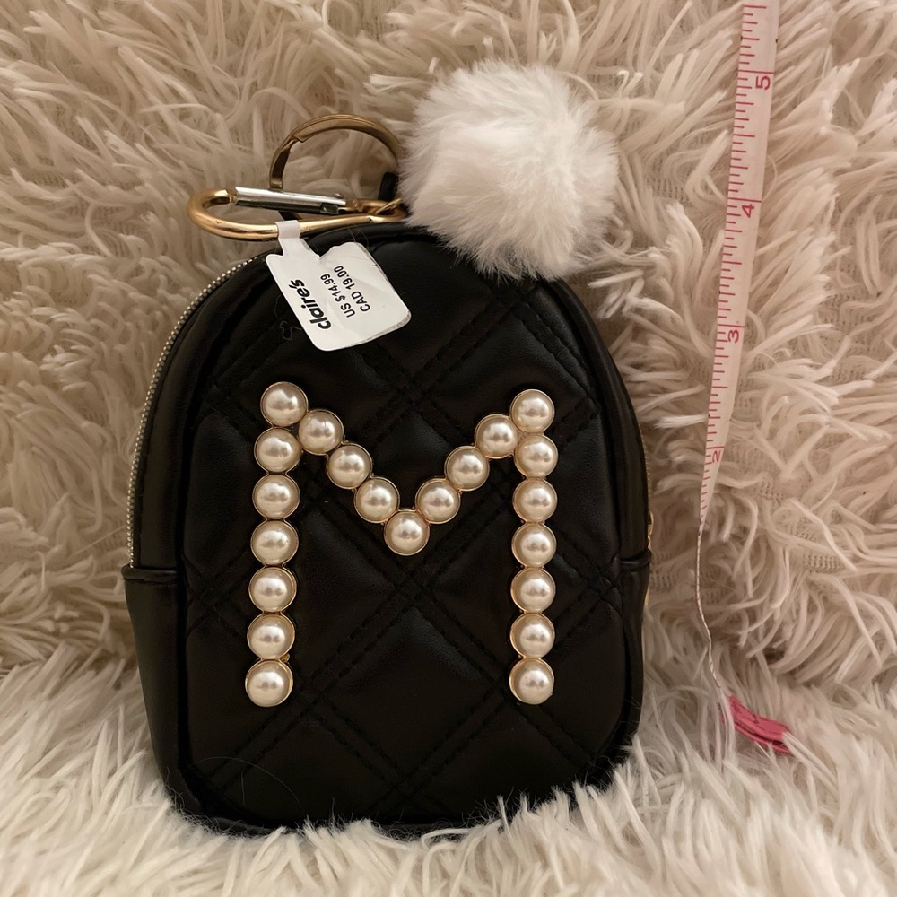 Claire’s 4 in mini backpack/keychain with “M”